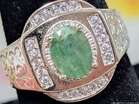 Front view showing emerald centre and CZ accents