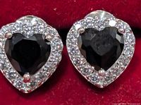 Front view showing both earrings, black heart centres, clear CZ halo
