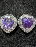 Front view showing heart-cut purple stones and surrounding clear stones