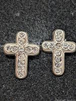 Front view showing rhinestone-set cross design