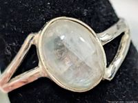 Front view of sterling silver ring showing moonstone cabochon and split shoulders
