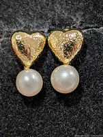 front view showing textured heart studs and pearl drops