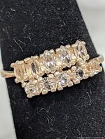 Front view of ring showing two rows of mixed-cut clear stones
