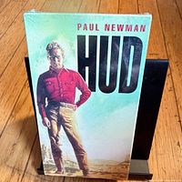 Front cover showing sealed VHS of Hud