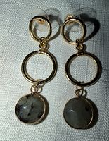 Full view of both earrings displaying three-circle design