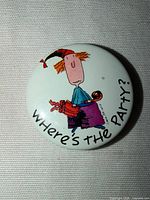 Front of button showing graphic and text