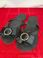 Top view of both flip flops showing bows and rhinestone buckles