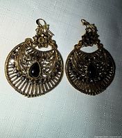 both earrings front view showing design and stones
