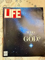Front cover showing LIFE logo, "Who Is God?" headline, starry background