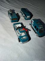 All four teal Philadelphia Eagles vehicles grouped
