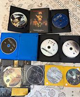 Overview of open cases with Lucky One, Homefront, R.I.P.D, 187 cover and additional sleeved discs