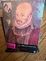 Front cover showing title, author, portrait artwork, bookstore sticker