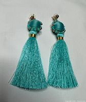 front view of both tassel earrings showing length and color