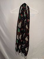 Full view of black Cejon scarf hanging