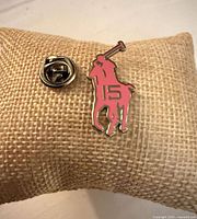 Front view of pink polo player #15 lapel pin with clutch