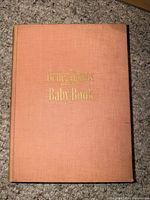 Front cover showing peach cloth binding and gilt title