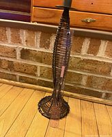 Full view of candlestick with ruler for scale