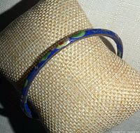 Full view of bangle on display pillow showing overall design