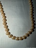 Close-up of cream faux pearl beads