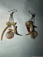 Front view of both earrings showing shell pieces and hooks