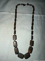 Full view of necklace laid flat showing overall length and bead arrangement