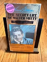 Front cover of VHS showing title, actor photo, Comedy sticker