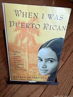 Front cover of paperback shows title, author, and artwork