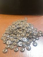 Pile of brown 2-hole buttons