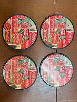 Front view of four Coca-Cola collage coasters