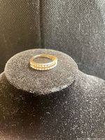 Top view of gold-tone double band ring with rhinestones displayed on ring form