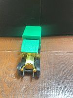 Front view showing green cab roof and radiator detail