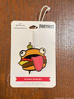 Front view of Hallmark Fortnite Durrr Burger ornament on backing card
