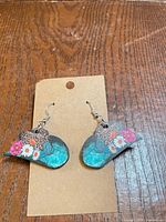 Front view of the wooden cowboy hat earrings on kraft card