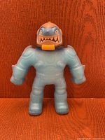 Front view of blue Air Vac Thrash figure standing upright