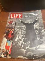 Front cover of LIFE magazine showing title, Berlin cover photo and side strip images
