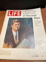 Front cover showing title, date and JFK portrait