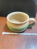 Side view of soup mug with measuring tape showing diameter