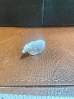 Front angled view of porcelain polar bear figurine