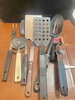 Full group of seven utensils laid out