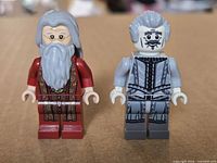 Front view of both minifigures showing torso and face prints