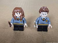 Front view of both minifigures with wands