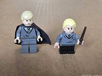 Front view of both Draco Malfoy minifigures