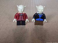 Front view of both goblin minifigures standing side by side