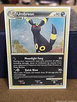 Front of Umbreon cosmos holo card showing artwork and text