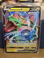 Front of Rayquaza V card in sleeve and toploader