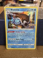 Front of Blastoise 17/78 card in protective toploader