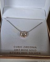 Necklace displayed in box showing pendant and chain