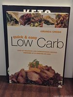 Front cover of Quick & Easy Low Carb with Keto book partially visible behind