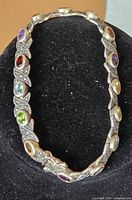 Full view of bracelet on display form showing gemstone and marcasite pattern