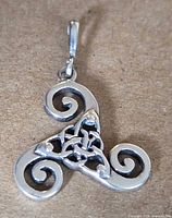 Front view of sterling silver Celtic triskelion pendant